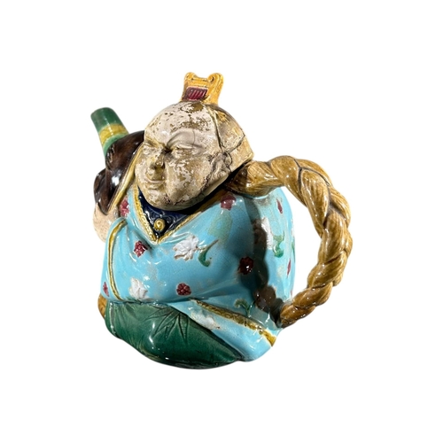 415 - A 19TH CENTURY MINTON MAJOLICA ‘CHINAMAN’ TEAPOT AND COVER, DATED 1874
Impressed Shape number 1838, ... 