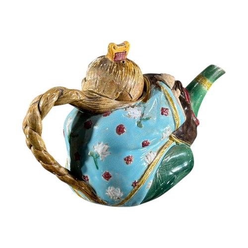 415 - A 19TH CENTURY MINTON MAJOLICA ‘CHINAMAN’ TEAPOT AND COVER, DATED 1874
Impressed Shape number 1838, ... 