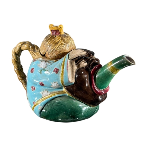 415 - A 19TH CENTURY MINTON MAJOLICA ‘CHINAMAN’ TEAPOT AND COVER, DATED 1874
Impressed Shape number 1838, ... 