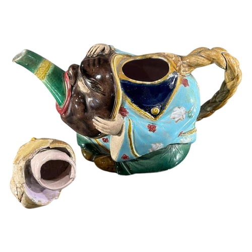 415 - A 19TH CENTURY MINTON MAJOLICA ‘CHINAMAN’ TEAPOT AND COVER, DATED 1874
Impressed Shape number 1838, ... 