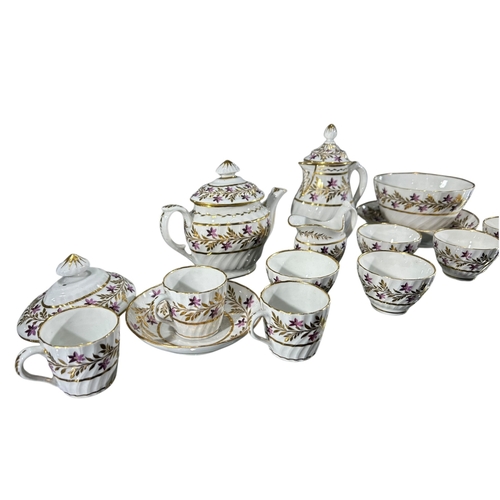 414 - A LATE 18TH/EARLY 19TH CENTURY CHAMBERLAIN WORCESTER PART TEA SET
Having floral gilt decoration, com... 