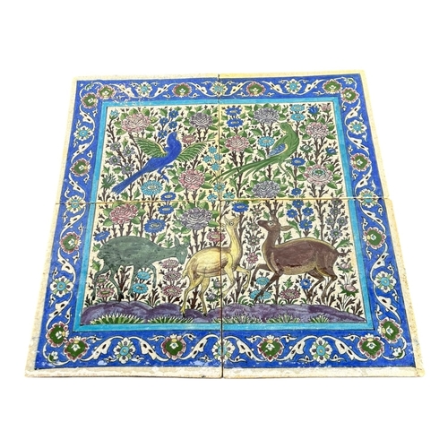 402 - FOUR LARGE IRANIAN 19TH CENTURY QAJAR TILES FORMING ONE LARGE SCENE
Decorated with two birds and thr... 