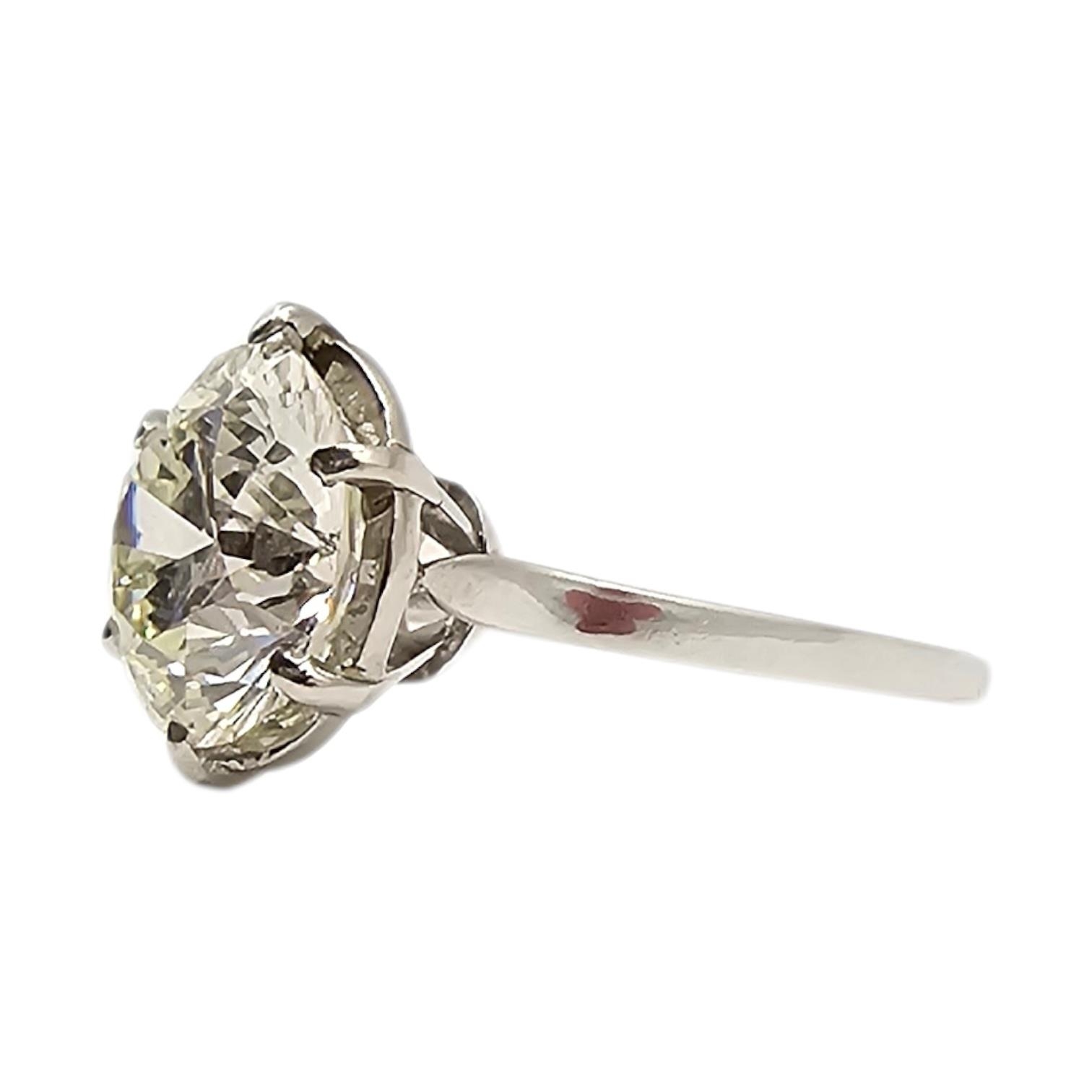 A WHITE METAL AND 4CT NATURAL DIAMOND SOLITAIRE RING (WHITE METAL ...