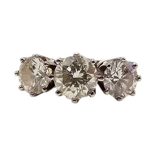 501 - AN 18CT GOLD 2.40CT NATURAL DIAMOND TRILOGY / ENGAGEMENT RING, HALLMARKED BIRMINGHAM
Having central ... 