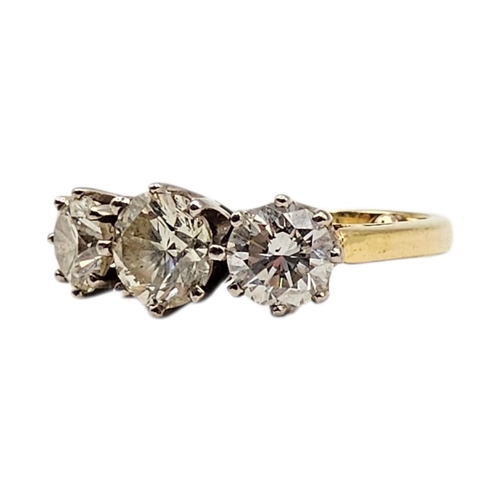 501 - AN 18CT GOLD 2.40CT NATURAL DIAMOND TRILOGY / ENGAGEMENT RING, HALLMARKED BIRMINGHAM
Having central ... 