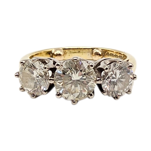 501 - AN 18CT GOLD 2.40CT NATURAL DIAMOND TRILOGY / ENGAGEMENT RING, HALLMARKED BIRMINGHAM
Having central ... 