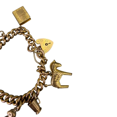 505 - 20TH CENTURY 9CT GOLD CURB LINK CHARM BRACELET WITH ATTACHED 9CT GOLD CHARMS
Heart lock clasp with m... 