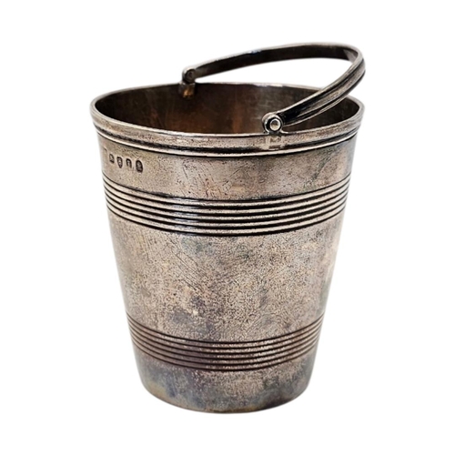 510 - AN EARLY 19TH CENTURY GEORGE III SILVER CREAM PALE
Hallmarked London, 1804, bucket form with reeded ... 