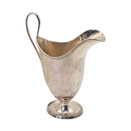 512 - JOHN YOUNGE & CO., AN 18TH CENTURY GEORGE III SILVER MILK JUG
Hallmarked Sheffield, 1780, helmet for... 