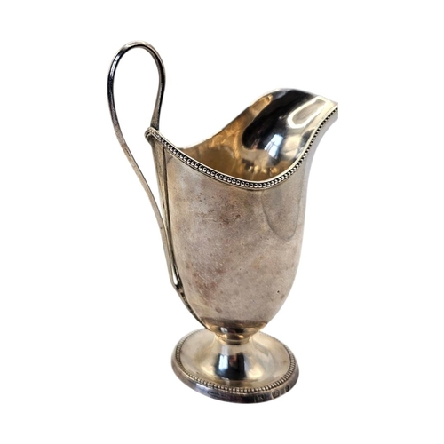 512 - JOHN YOUNGE & CO., AN 18TH CENTURY GEORGE III SILVER MILK JUG
Hallmarked Sheffield, 1780, helmet for... 