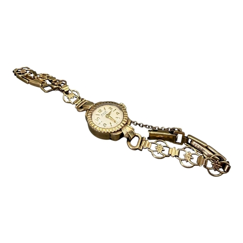 515 - AVIA, 9CT GOLD LADIES’ WRISTWATCH
Hallmarked Birmingham, 1956, having beige steel dial with gold ton... 