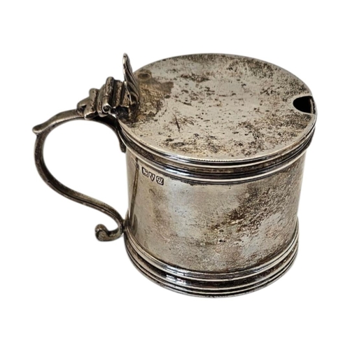 518 - STOKES & IRELAND LTD, A LARGE EDWARDIAN STYLE SILVER MUSTARD POT
Hallmarked Chester, 1920, plain cyl... 