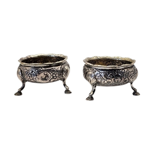 522 - A PAIR OF 18TH CENTURY GEORGE II SILVER SALTS
Hallmarked London, having repoussé chased floral and l... 