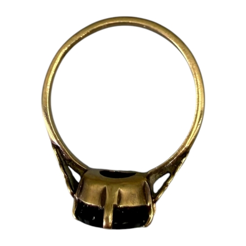 525 - A 20TH CENTURY 9CT GOLD AND ONYX RING
Having central flat carved oval onyx (approx.12.5mm x 8mm) wit... 