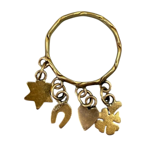 527 - A 20TH CENTURY CONTINENTAL YELLOW METAL ‘LUCK’ CHARM RING (YELLOW METAL TESTS AS 18CT)
Charms compri... 
