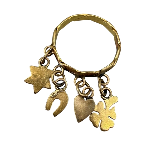 527 - A 20TH CENTURY CONTINENTAL YELLOW METAL ‘LUCK’ CHARM RING (YELLOW METAL TESTS AS 18CT)
Charms compri... 