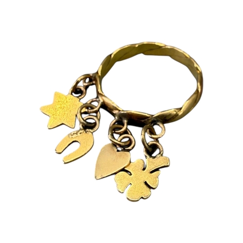 527 - A 20TH CENTURY CONTINENTAL YELLOW METAL ‘LUCK’ CHARM RING (YELLOW METAL TESTS AS 18CT)
Charms compri... 