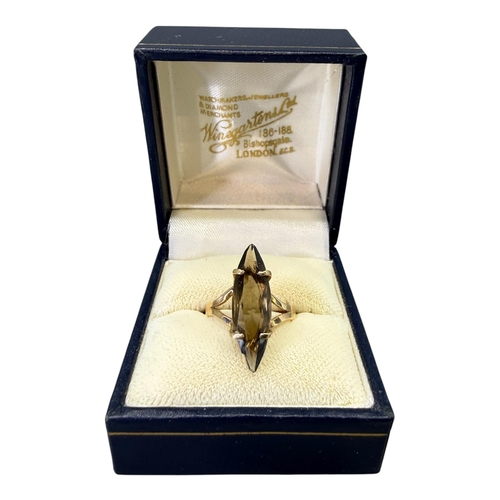 531 - A VINTAGE 9CT GOLD AND SMOKY QUARTZ MARQUESE CUT RING
Hallmarked London, 1988, smoky quartz (approx.... 