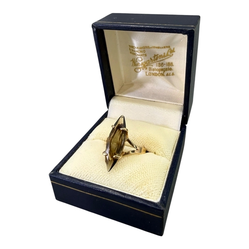 531 - A VINTAGE 9CT GOLD AND SMOKY QUARTZ MARQUESE CUT RING
Hallmarked London, 1988, smoky quartz (approx.... 