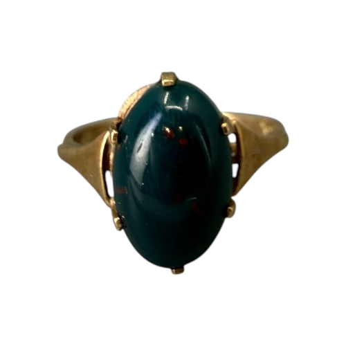 533 - A 20TH CENTURY 9CT GOLD AND BLOODSTONE CABOCHON CUT RING
The central oval cabochon cut bloodstone (a... 