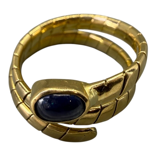 559 - MANNER OF BVLGARI/BULGARI, 20TH CENTURY DESIGNER STYLE 18CT GOLD AND BLUE LABRODITE ‘SERPENTI’ RING
... 