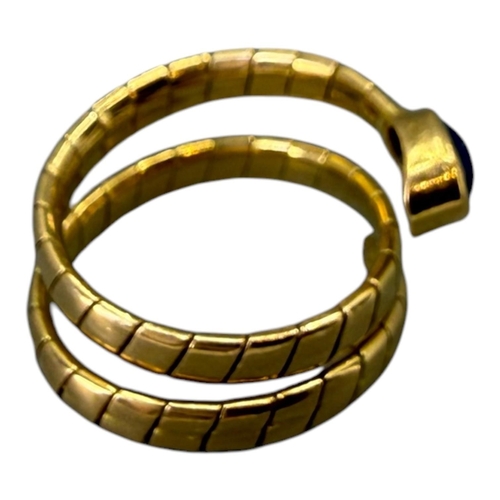 559 - MANNER OF BVLGARI/BULGARI, 20TH CENTURY DESIGNER STYLE 18CT GOLD AND BLUE LABRODITE ‘SERPENTI’ RING
... 