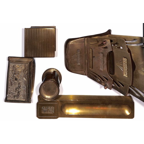 6 - Brass. Desk accessories comprising pen tray with stamp box at one end, stylised leaf pattern to the ... 