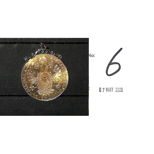 6 - Austria.  1915 4 Ducat coin struck in 23k gold, a gold mount attached, the coin a little buckled, we... 