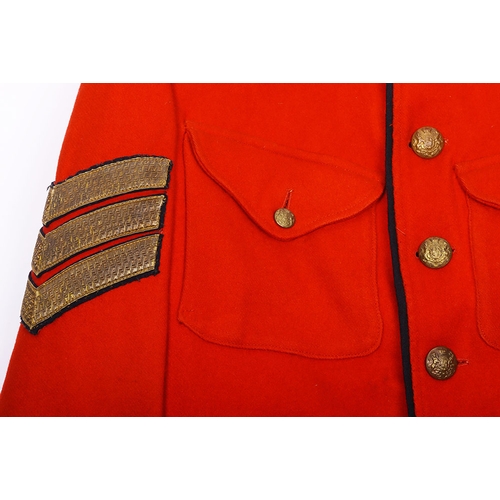 106 - Victorian scarlet wool tunic with blue cloth collar, epaulettes and facing. Bearing gold lace rank c... 