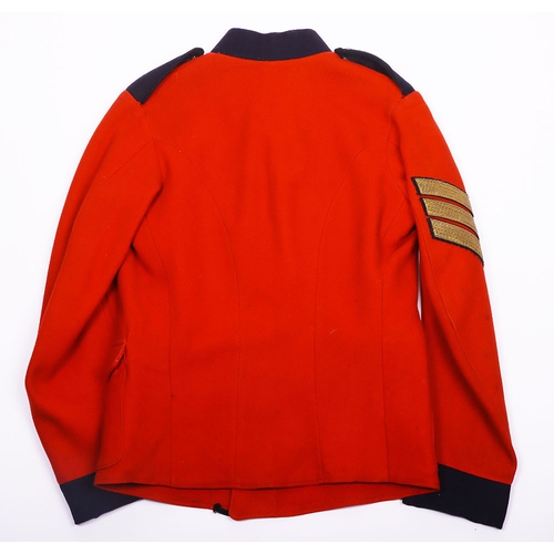106 - Victorian scarlet wool tunic with blue cloth collar, epaulettes and facing. Bearing gold lace rank c... 