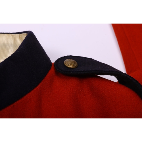 106 - Victorian scarlet wool tunic with blue cloth collar, epaulettes and facing. Bearing gold lace rank c... 