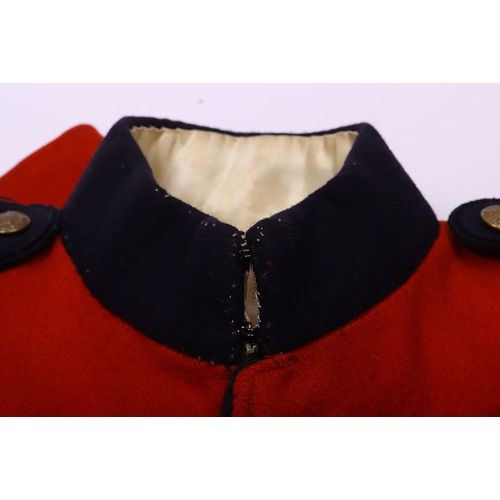 106 - Victorian scarlet wool tunic with blue cloth collar, epaulettes and facing. Bearing gold lace rank c... 