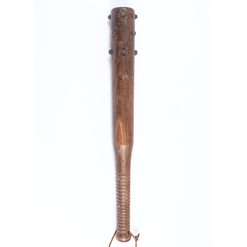 258 - WW1 British Workshop Made Trench Club. A WW1 wooden trench club studded with hobnails with a weighte... 