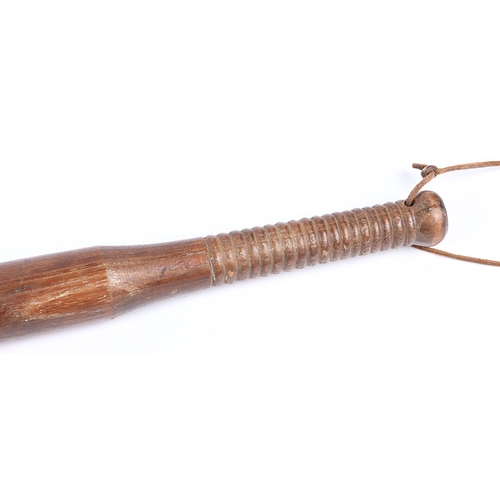 258 - WW1 British Workshop Made Trench Club. A WW1 wooden trench club studded with hobnails with a weighte... 
