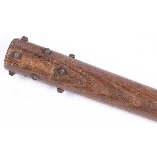 258 - WW1 British Workshop Made Trench Club. A WW1 wooden trench club studded with hobnails with a weighte... 