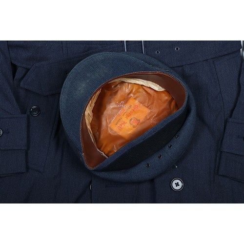 900 - RAF Officer's Peaked Cap & Rain Coat. Cold War. A fair condition example of a RAF Officers peake... 