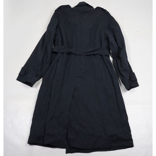 900 - RAF Officer's Peaked Cap & Rain Coat. Cold War. A fair condition example of a RAF Officers peake... 