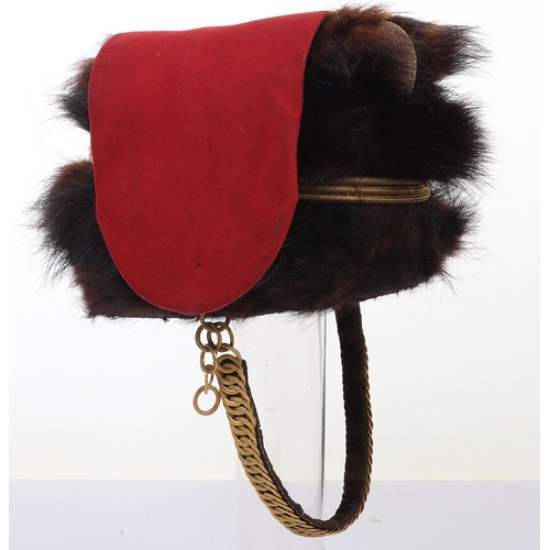 10 - Hussar Officers Busby. Officers fur busby with plain scarlet bag, fitted with oval gilt cord cockade... 