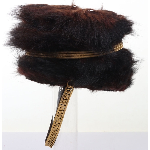 10 - Hussar Officers Busby. Officers fur busby with plain scarlet bag, fitted with oval gilt cord cockade... 