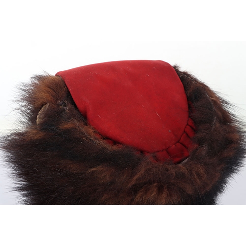10 - Hussar Officers Busby. Officers fur busby with plain scarlet bag, fitted with oval gilt cord cockade... 