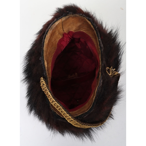 10 - Hussar Officers Busby. Officers fur busby with plain scarlet bag, fitted with oval gilt cord cockade... 