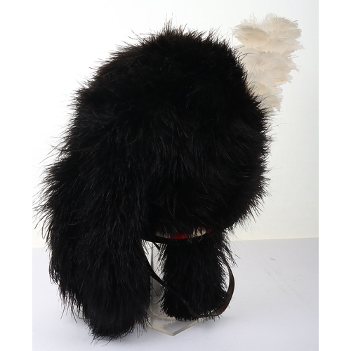 22 - Highlanders ostrich feather bonnet with 4 tails, silk rosette, diced band with velvet edge, and blac... 