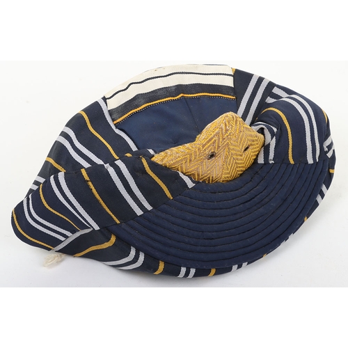 50 - Indian Army Turban, of recent manufacture, made from blue cloth with gilt embroidery. In unissued co... 