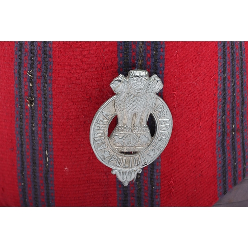 51 - Indian Police Turban. Grey & crimson turban with WM badge, brown leather headband and issue stam... 