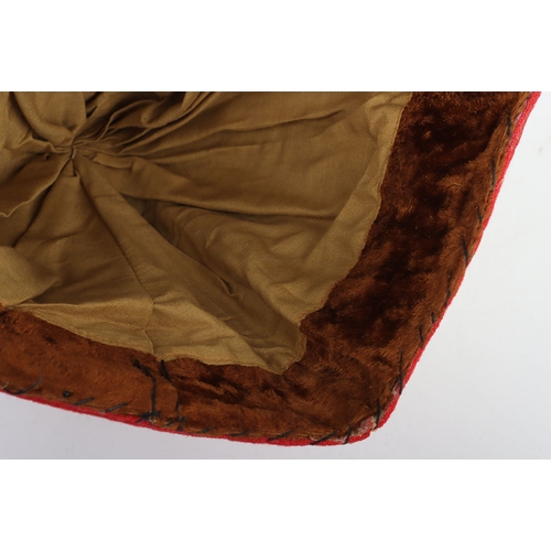 55 - Indian Army Kulla, made from scarlet cloth with gilt embroidery, fawn lining and brown headband stam... 