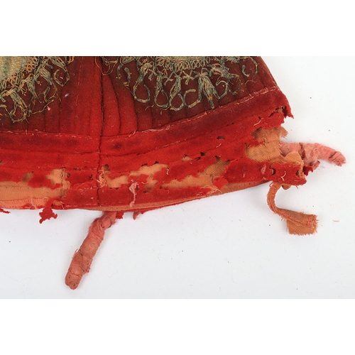 56 - Indian Army Kulla, made from scarlet cloth with gilt embroidery. In poor and damaged condition