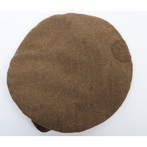 27 - Great War Scottish Tam O'Shanter, khaki wool example with cloth quilted lining to the interior. Rema... 