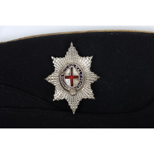58 - Coldstream Guards Field Service Cap, of dark blue cloth with gilt wire braid to the crown. Regimenta... 