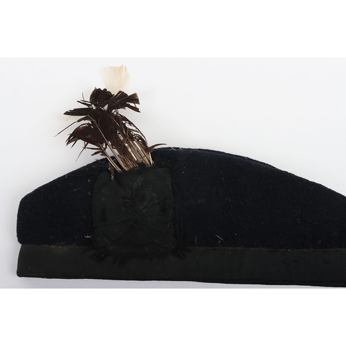 37 - Scottish Glengarry, blue wool with ribboned lower band, two tallies to the rear. Feather hackle behi... 