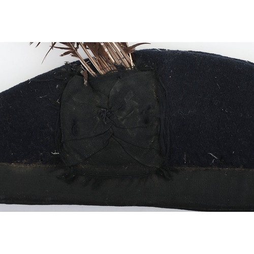 37 - Scottish Glengarry, blue wool with ribboned lower band, two tallies to the rear. Feather hackle behi... 